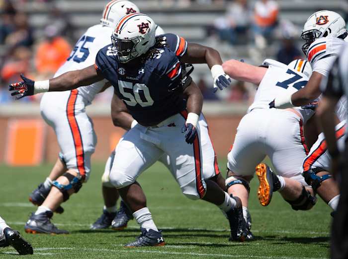 Auburn Tigers defensive lineman Marcus Harris (50) breaks through the line during Spring Practice.